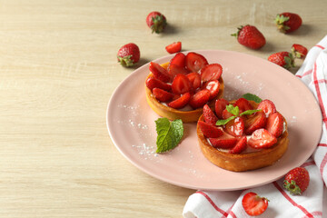 Concept of tasty food with strawberry tart on wooden table