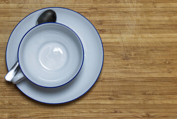 flat lay top view of white teacup wooden background