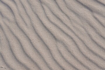 Fototapeta na wymiar Abstract sand texture background, beach sand pattern.
