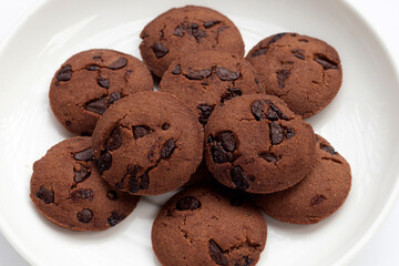 Chocolate chip cookies in white plate