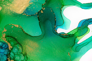 Watercolor green ink drops and paint drips pattern with gold dust texture.