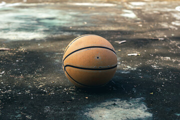Old Basketball on old cement floor.