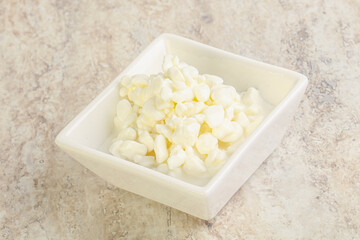 Grained cottage cheese in the bowl