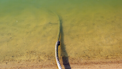 iron cable lies in the water