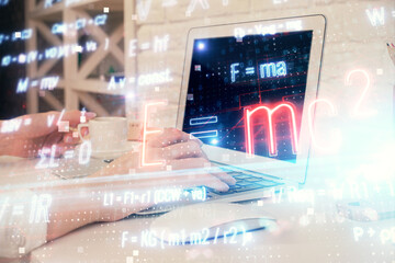 Double exposure of woman hands typing on computer and formula hologram drawing. Education concept.