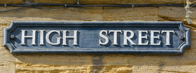 High Street name sign, close up of old style of English street plaque, shallow depth of field, autumn season 2021 - 461008751