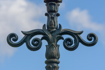 Close up of decorative lamppost, iron work, architecture detail, shallow depth of field, autumn...