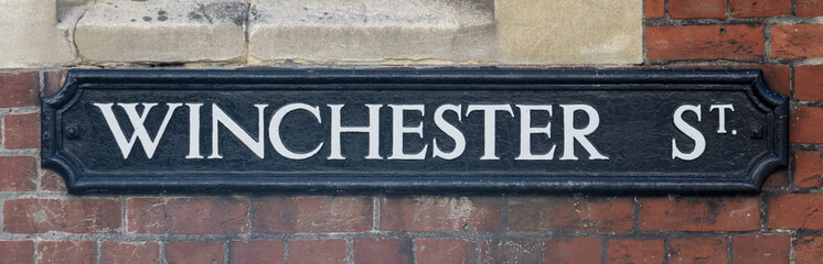 Winchester Street name sign, close up of old style of English street plaque, shallow depth of field, autumn season 2021 - 461008755
