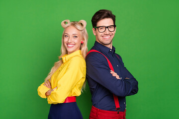 Profile side photo of young cheerful couple folded hands partners dance party glasses isolated over green color background