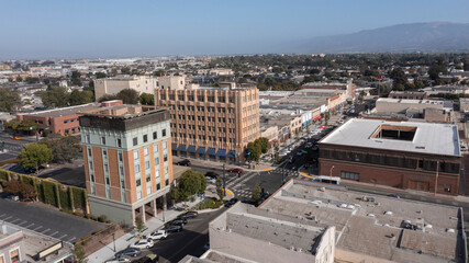During a break in the fog, afternoon sunlight shines on the historic city center of downtown Salinas, California, USA.