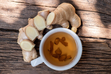 Ginger rhizome and tea on nature background.top view,flat lay.
