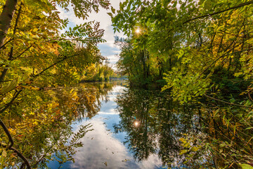 Amazing autumn landscape - small pond in the autumn park - A beautiful autumn day - colorful autumn