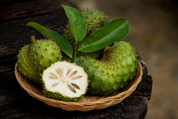 Soursop or annona muricata fruits on nature background.