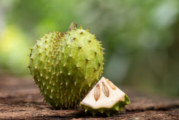 Soursop or annona muricata fruits on nature background.