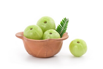 Indian Gooseberry or Phyllanthus emblica fruits and green leaves isolated on white background.