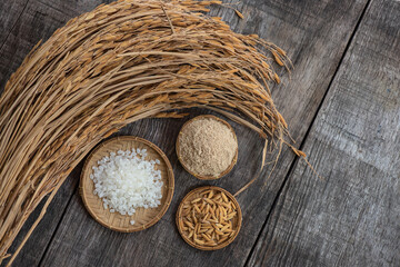 Japanese rice seed,paddy and ear of rice on an old wooden background.top view,flat lay.
