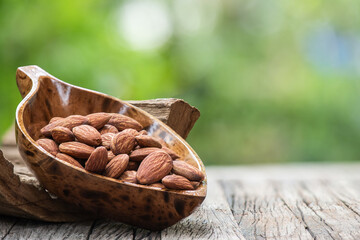 Almond dried seeds on nature background.