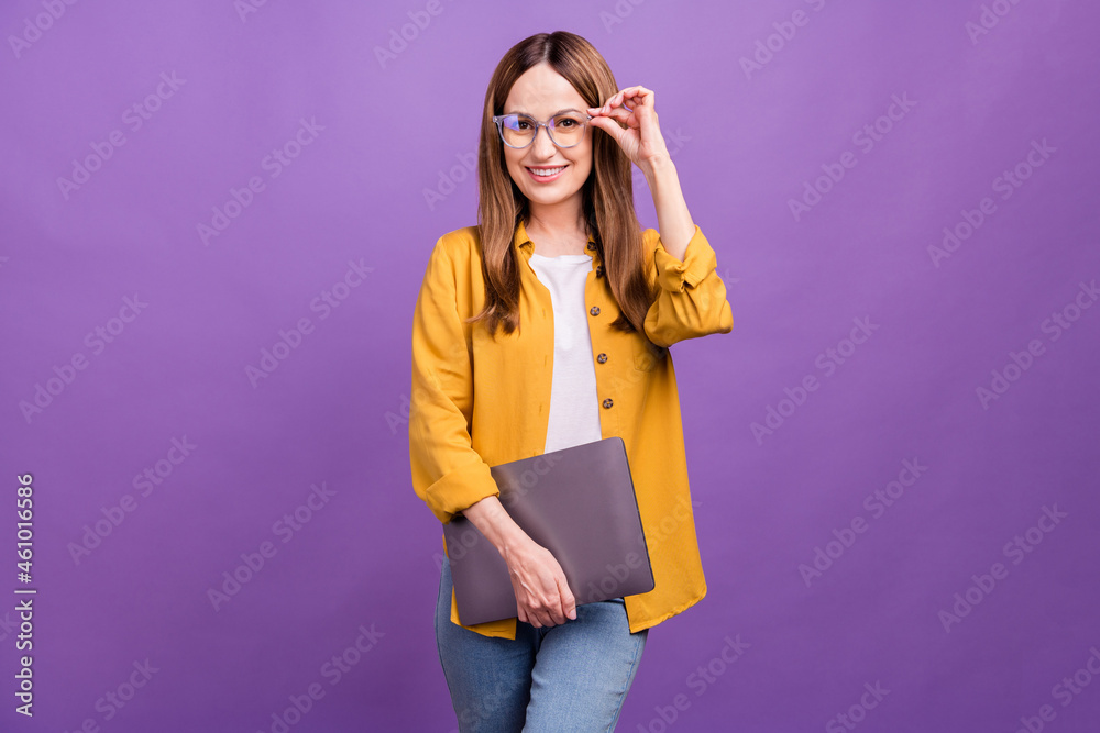 Sticker Photo of mature confident woman eyewear hold laptop freelancer agent isolated over violet color background