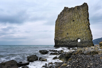 View of Sail Rock (Parus Rock) on cloudy winter day. Black Sea, Krasnodar Krai, Russia.