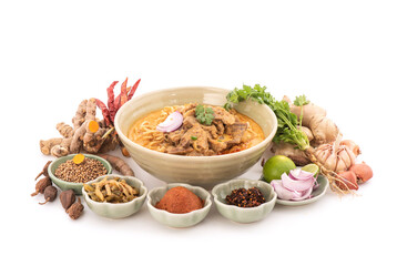 Northern thai curry noodles with beef isolated on white background.