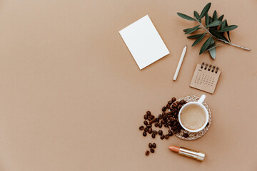 Obraz na płótnie Canvas Blank paper card and a cup of coffee. Minimalist concept. Business template, copy space, flat lay. Modern desk workspace