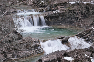 View of waterfall on Zhane river on cloudy winter day. Krasnodar Krai, Caucasus, Russia.