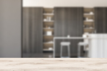 Grey kitchen interior with table and chairs, blurred background