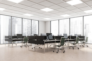 Business room interior with armchairs and computers in row, city view
