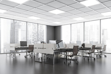 Business room interior with armchairs and computers in row, city view