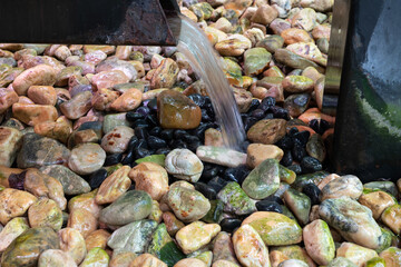 Water flow from the gutter down to the gravel floor.