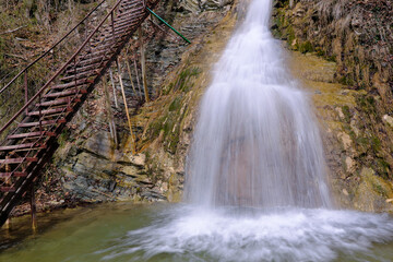 View of Lace (Shnurok) waterfall in Teshebs river gorge on winter day. Gebiusskie waterfalls,...