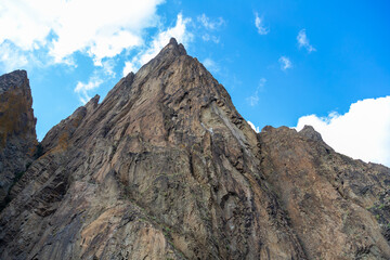 Brown mountain on the background of deep blue sky view from below