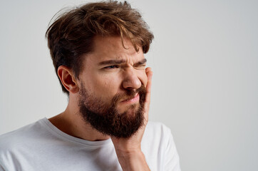 Fototapeta premium emotional man medicine toothache and health problems isolated background