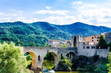 Fototapeta na wymiar Famous medieval bridge over the river Fluvia in the medieval village de Besalú, Girona, Catalonia, Spain