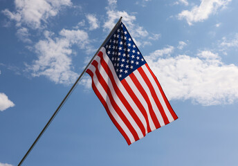 US American flag hanging on flagstaff