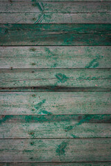 Wooden logs of an old house. Close-up. Weathered green wood texture. Background. Horizontal vertical photo.