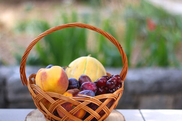 Vintage basket filled with various fruit. Selective focus.