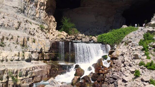 Shallow Waterfall Cascading From Afqa In Lebanon - tilt up shot