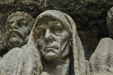 Sculpture monument to sad senior woman. 