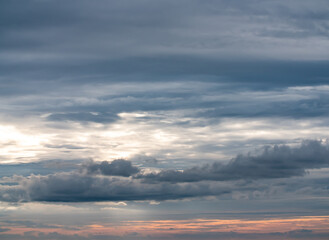 Overcast sky with orange glowing horizon
