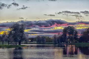 purple sunset over a pond in a park