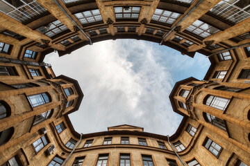 Photo of symmetrical courtyard in residential house from historical center of Saint Petersburg in...