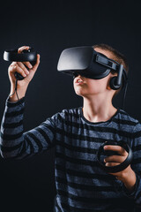 Teenager boy playing in virtual reality