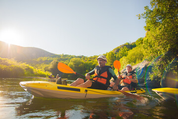 Two kayakers getting back to the group
