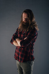 Beautiful strong nordic man with stylish hairstyle and beard on a isolated background.