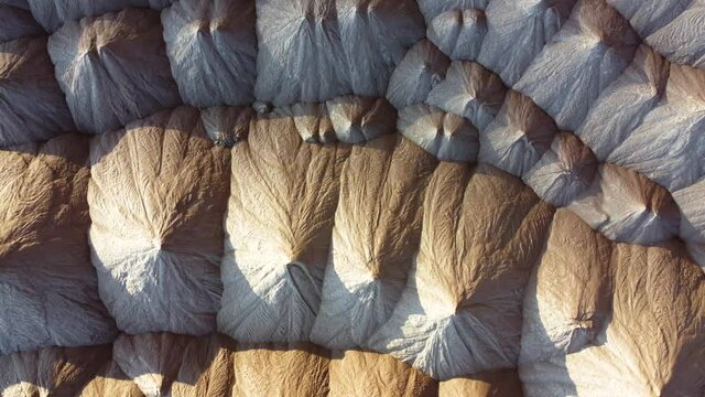 Industrial salt mining. Aerial view of a quarry for the extraction of minerals. Mountains of products for the production of potash salt. Extraction of potash fertilizers