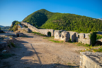 Ruins of medieval fortress Tvrdava Mogren at the shore of Adriatic sea, Montenegro.