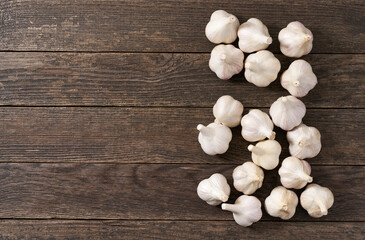organic garlic on a wooden table, top view.