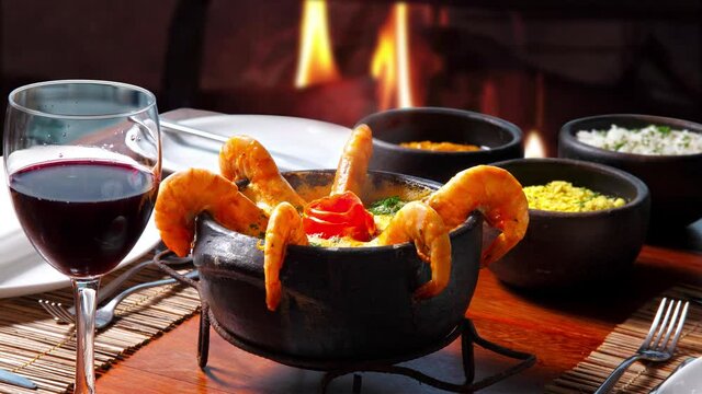 Shrimp and fish moqueca with rice, farofa and mush