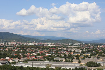 Fototapeta na wymiar view of the city. Scenic view of the town in the mountains on a cloudy summer day.